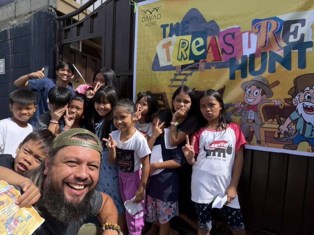 Pastor Al and children at the Treasure Hunt summer kids program